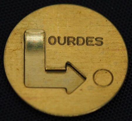 punched out Lourdes punch press logo
