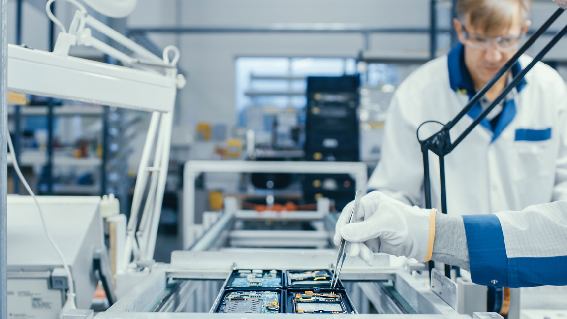 circuit boards being manufactured in a cleanroom environment